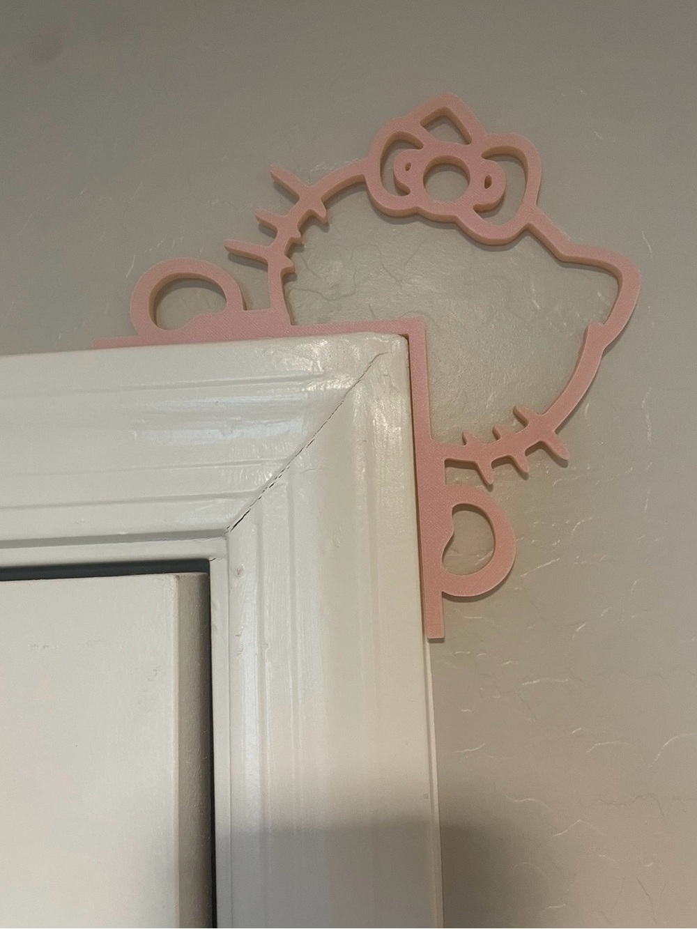 Pink Hello Kitty Peekaboo Door Decor